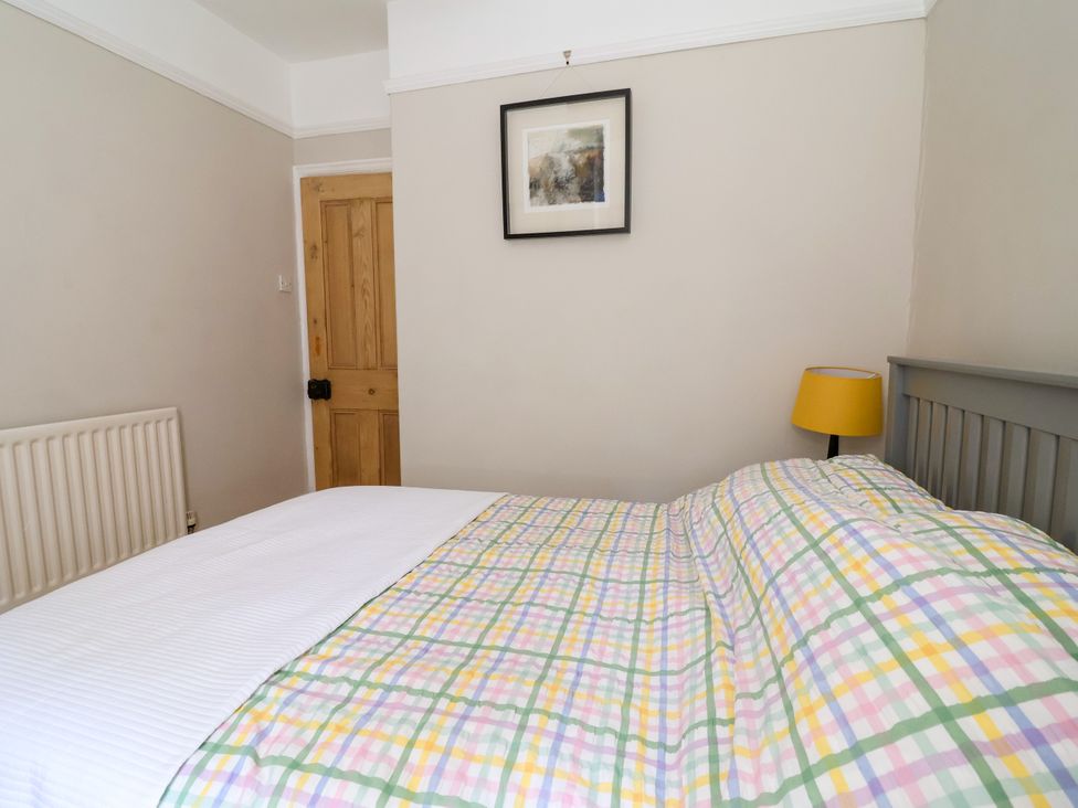 A bedroom with a bed and lamp at 45 Brook Lane in Chester