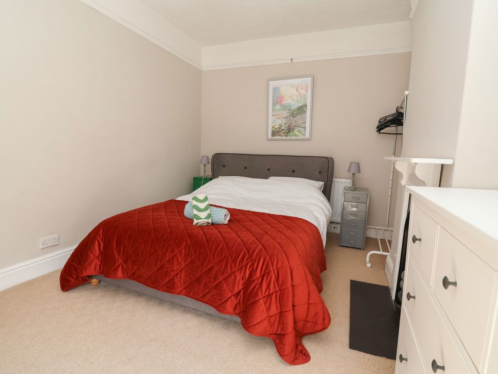 A bedroom with a bed and bedside lamp at 45 Brook Lane Chester