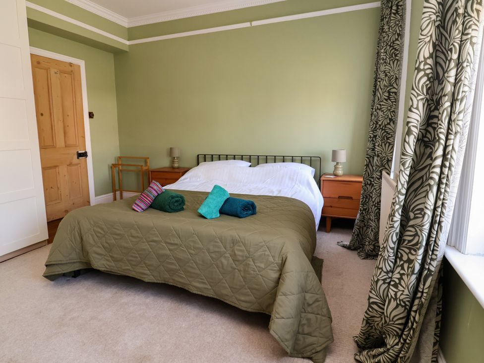 A bedroom with a bed and bedside table at 45 Brook Lane Chester