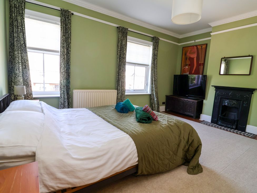 A bedroom with a bed and television at 45 Brook Lane in Chester