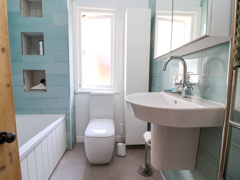 A bathroom with a toilet, sink, and bath tub at 45 Brook Lane, Chester