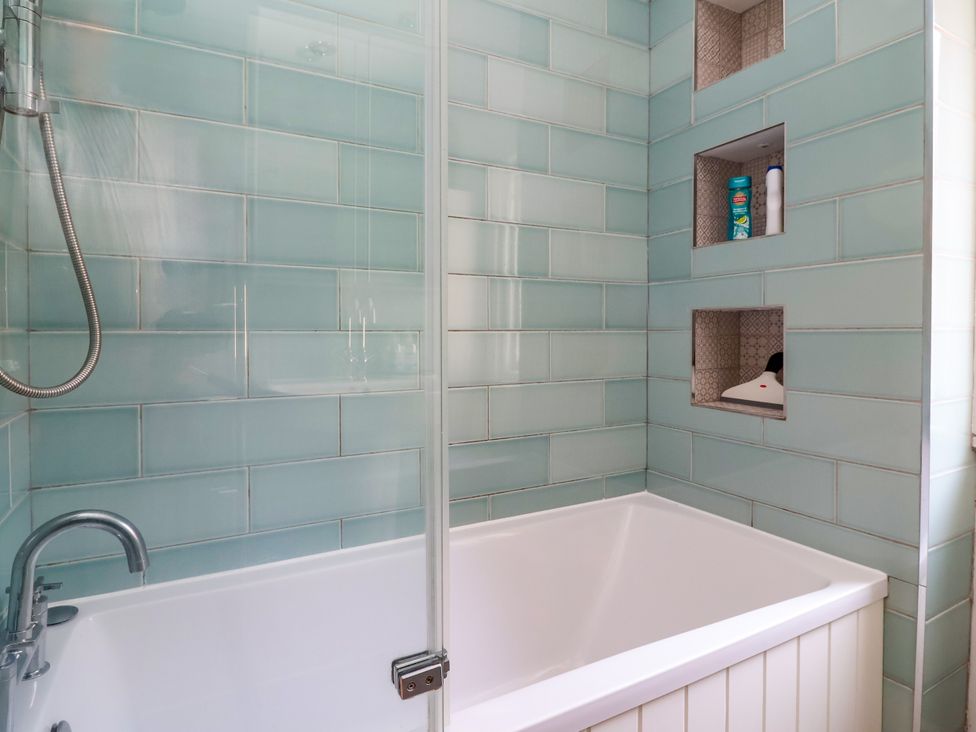 A bathroom with a bathtub and shower at 45 Brook Lane in Chester