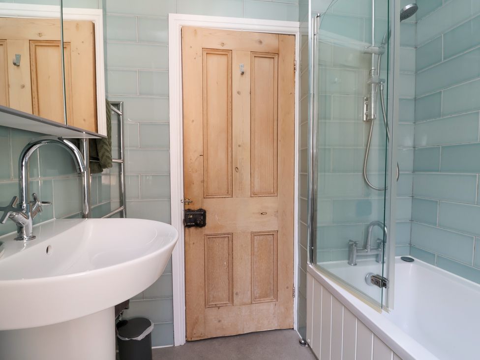 A bathroom with a sink, shower, and bathtub at 45 Brook Lane in Chester