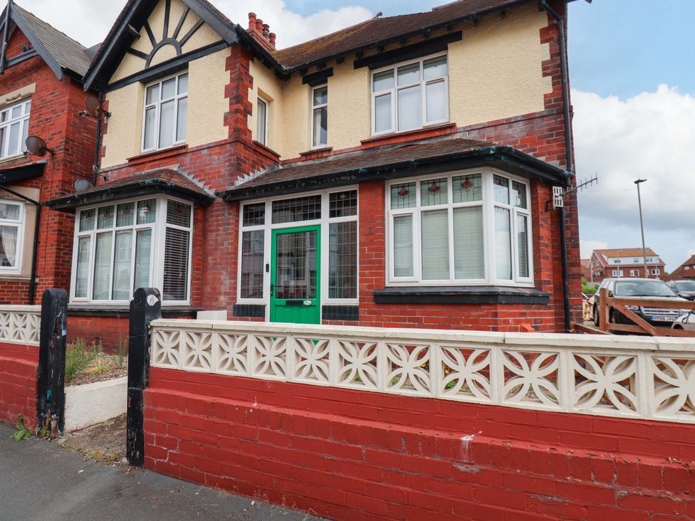 A house with green door and windows at Falcon's Nest in Whitby