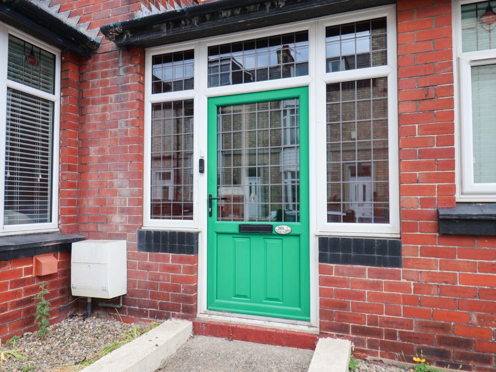 A front entrance with a green door at Falcon's Nest in Whitby