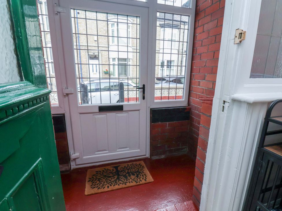 An entrance with a door and doormat at Falcon's Nest in Whitby