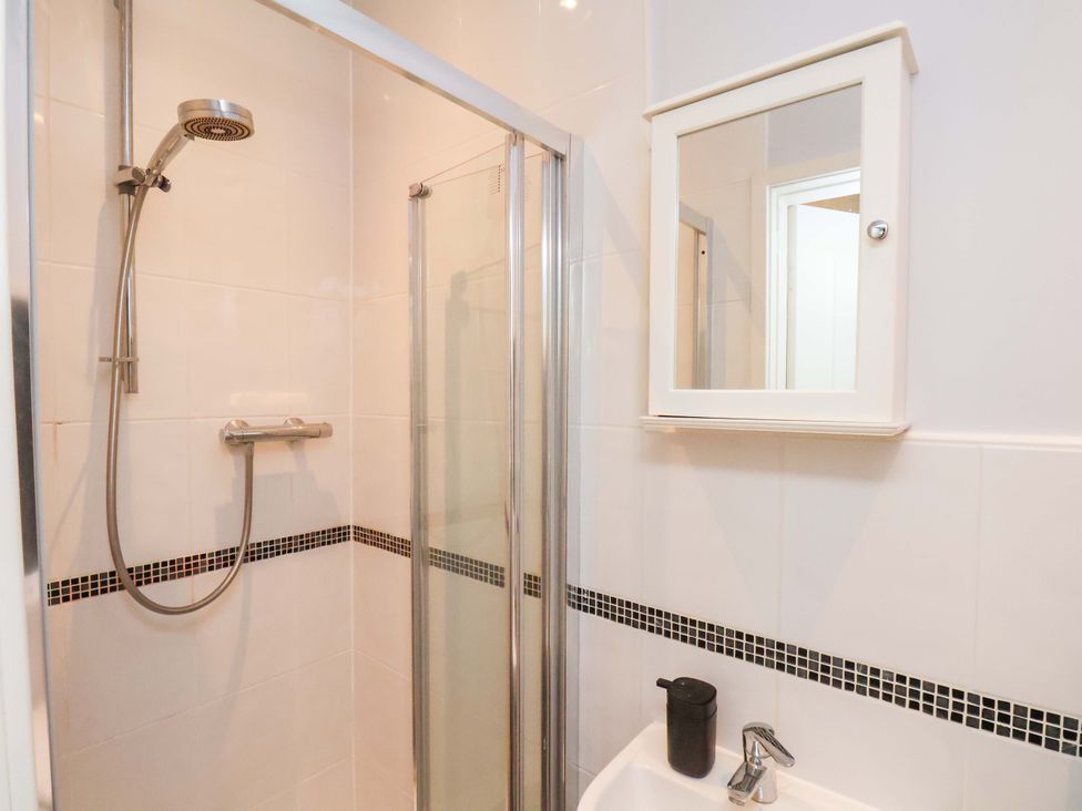 A bathroom with shower and sink at Falcon's Nest in Whitby