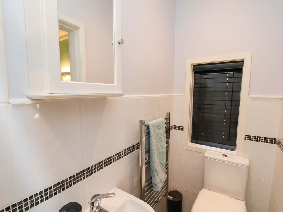 A bathroom with a sink and toilet at Falcon's Nest in Whitby