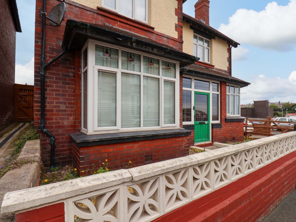 An exterior view of a house with a green door at Falcon's Nest, Whitby