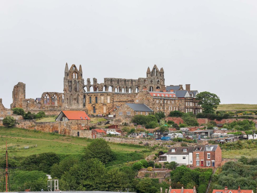 A landscape with ruins and houses at Falcon's Nest in Whitby