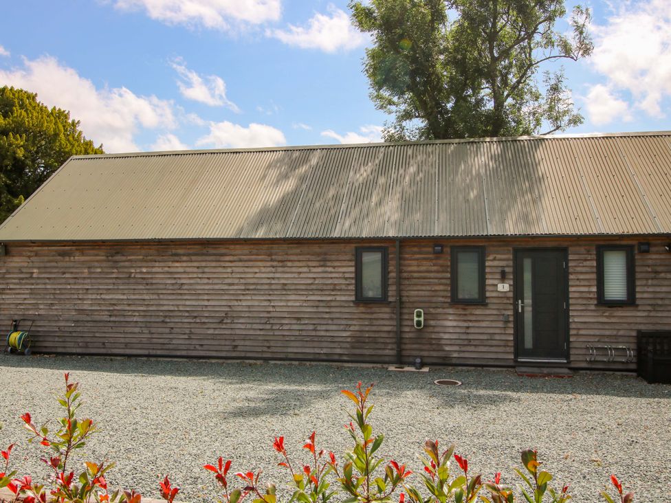 A wooden cabin with a metal roof at Stiper View Barn 1 Gravels Bank