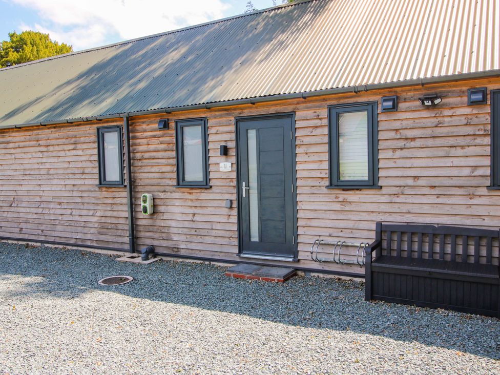 An outdoor view of a wooden barn exterior at Stiper View Barn 1 Gravels Bank