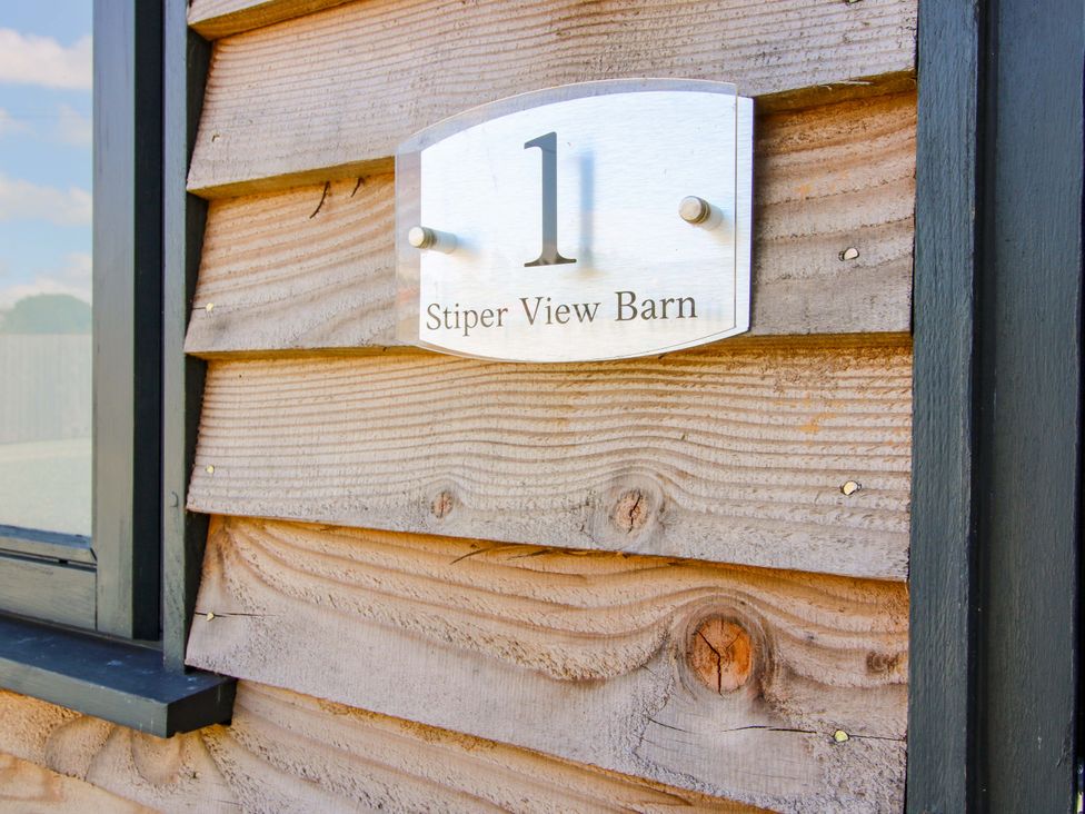 A sign displaying number 1 and the name Stiper View Barn 1 at Gravels Bank