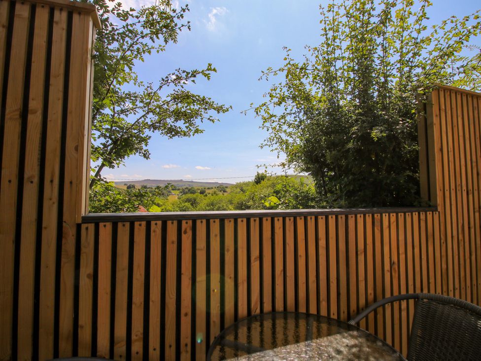 A view from a balcony with greenery and landscape at Stiper View Barn 1 Gravels Bank