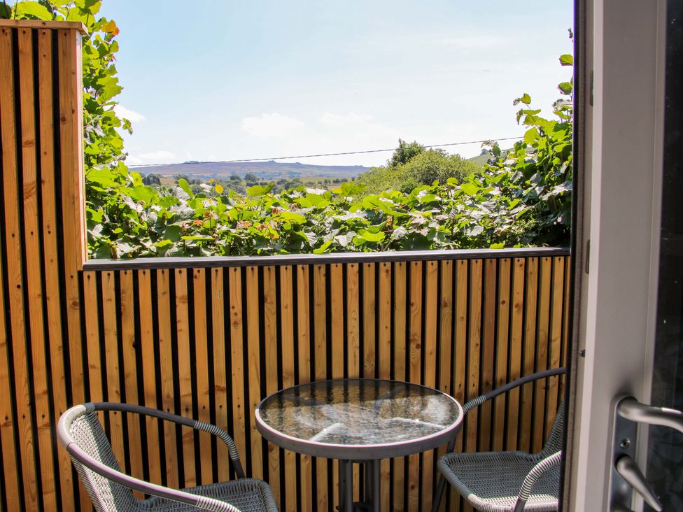 A balcony with a table and chairs at Stiper View Barn 2 in Gravels Bank