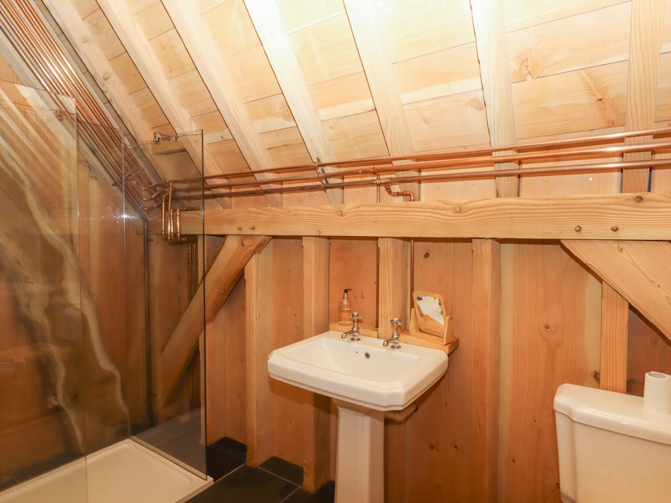 A bathroom with a shower and sink at Pucklechurch in Kingsteignton