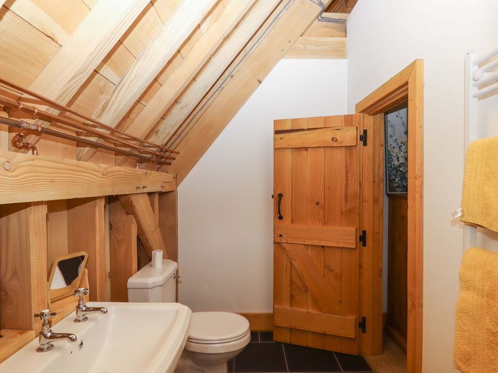 A bathroom with a sink and toilet at Pucklechurch in Kingsteignton