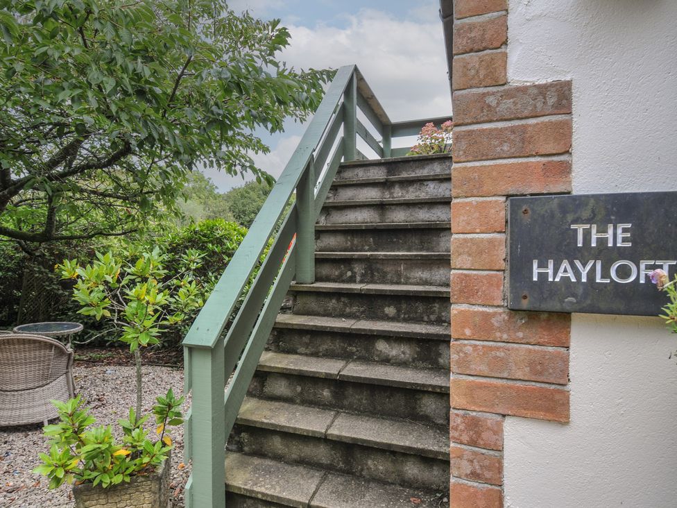 Stairs leading to The Hayloft with sign at Lostwithiel