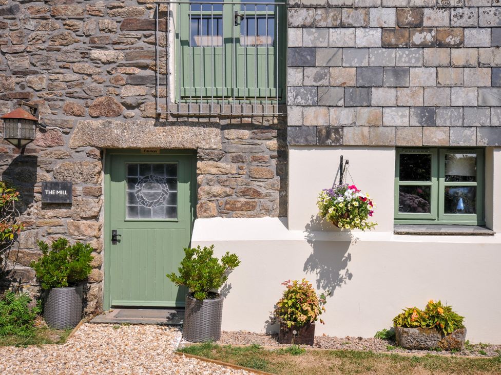 An outdoor view showing a door and window at The Mill in Lostwithiel