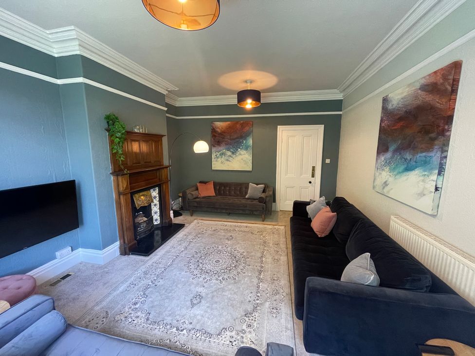 A living room with a sofa and coffee table at Montclair