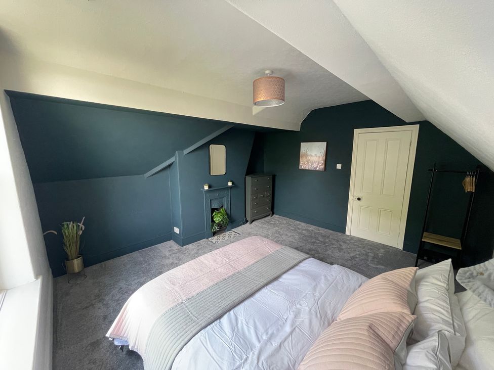 A bedroom with a bed and a chest of drawers at Montclair