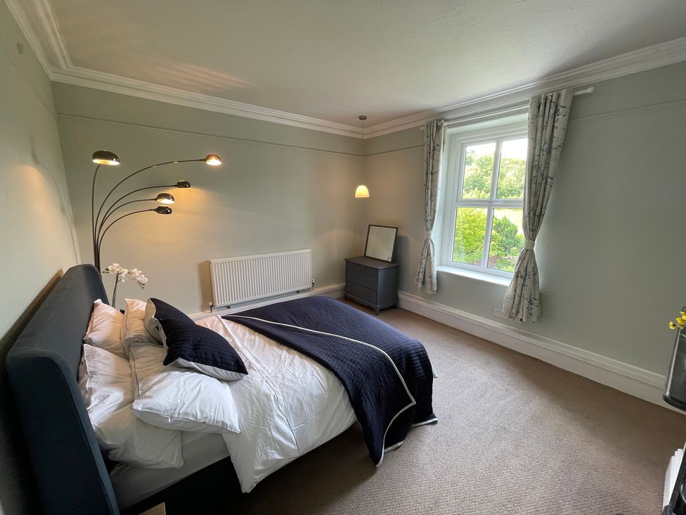 A bedroom featuring a bed and nightstand at Montclair