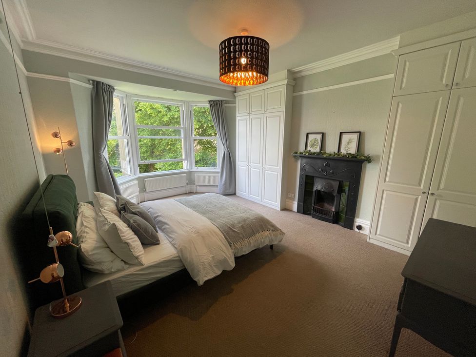 A bedroom with a bed and wardrobe at Montclair