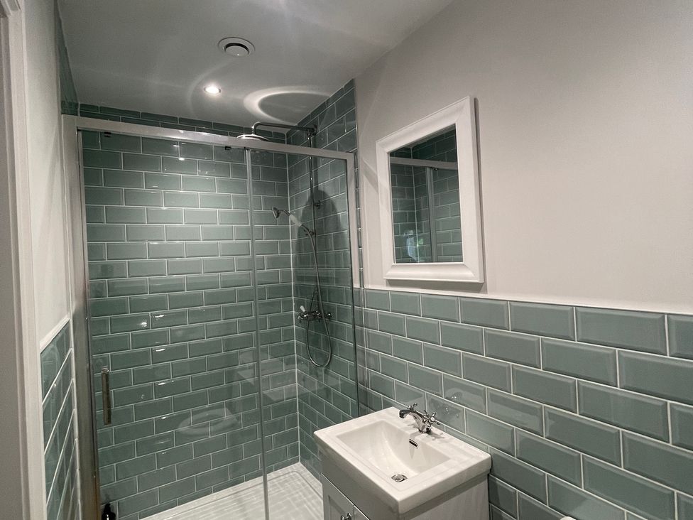 A bathroom with shower and sink at Montclair