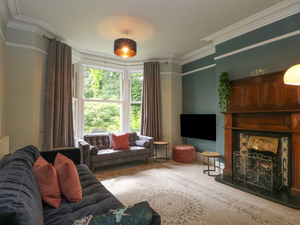 A living room with a sofa and fireplace at Montclair in Buxton