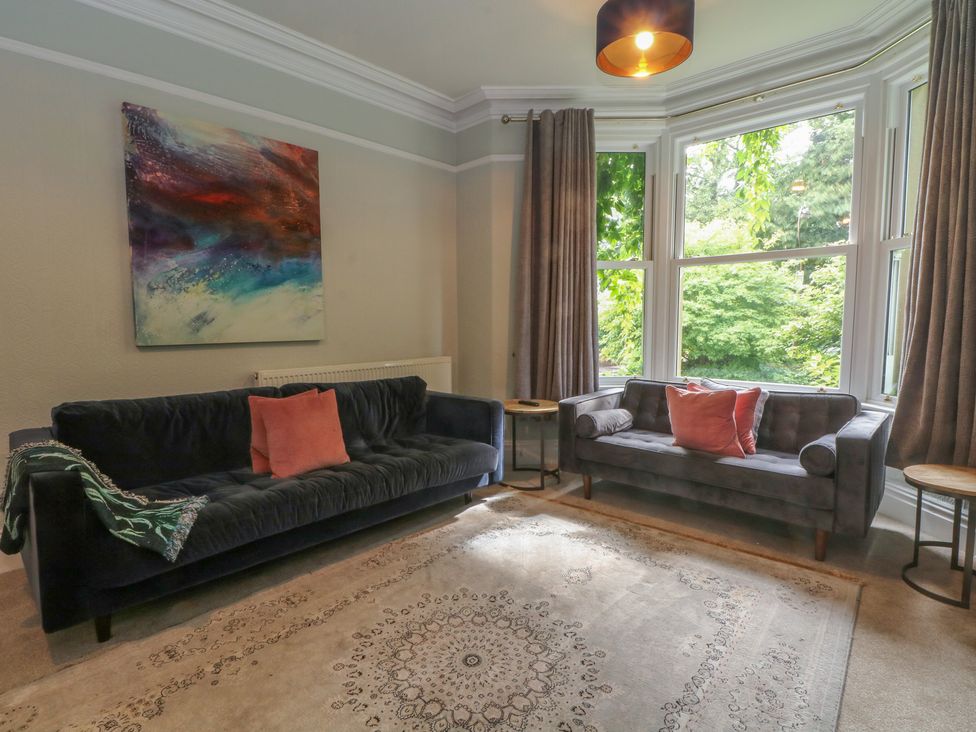 A living room with two sofas and a rug at Montclair in Buxton