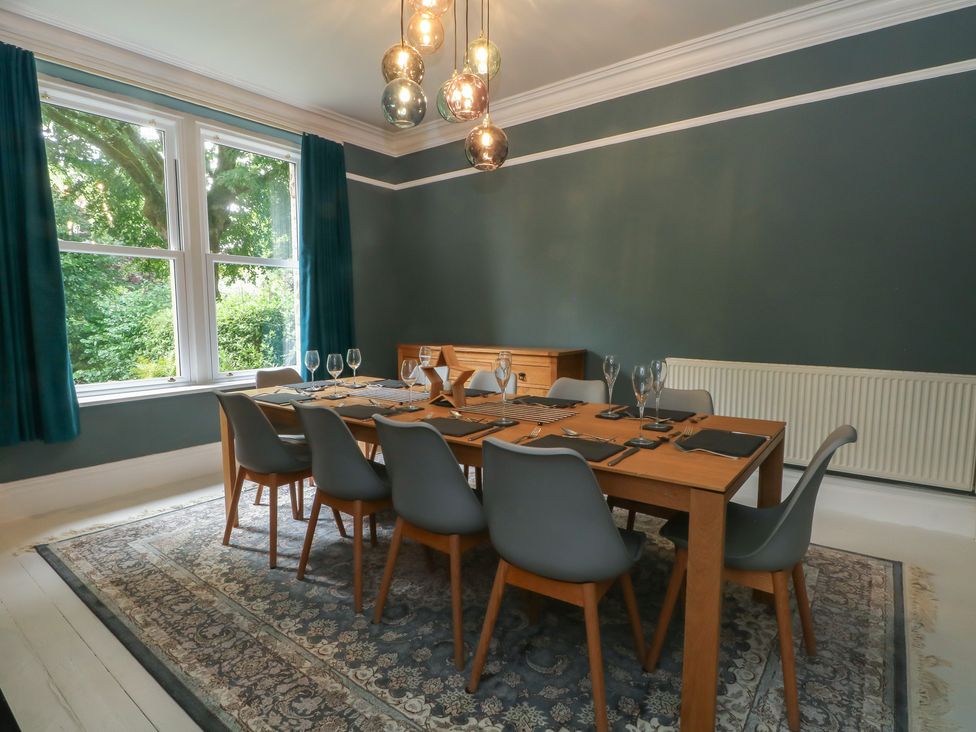 A dining room with a table set for dinner at Montclair in Buxton