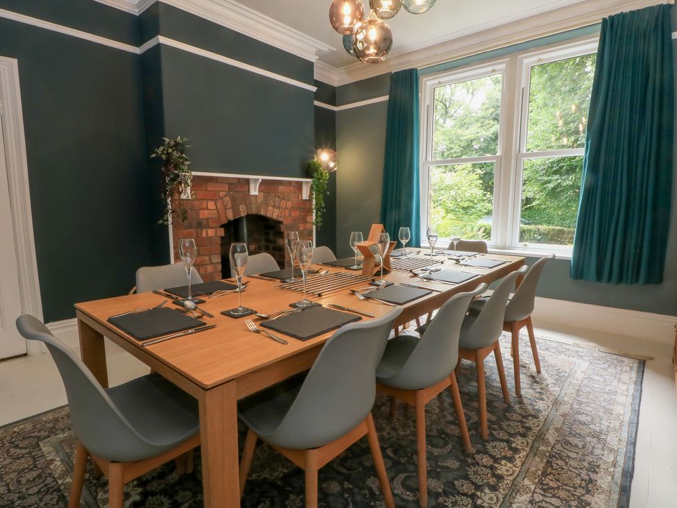 A dining room with a table set for dinner at Montclair in Buxton