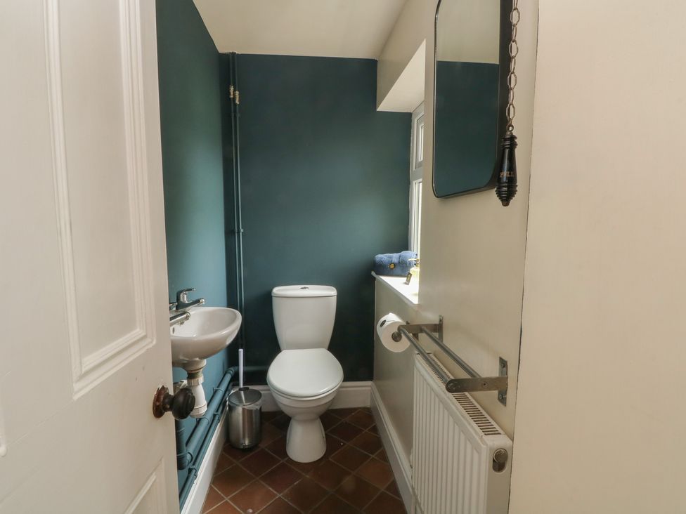 A bathroom with a toilet and sink at Montclair in Buxton