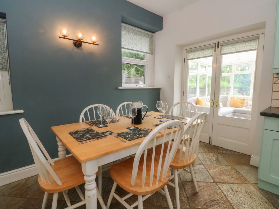 A dining room with a table and chairs at Montclair in Buxton