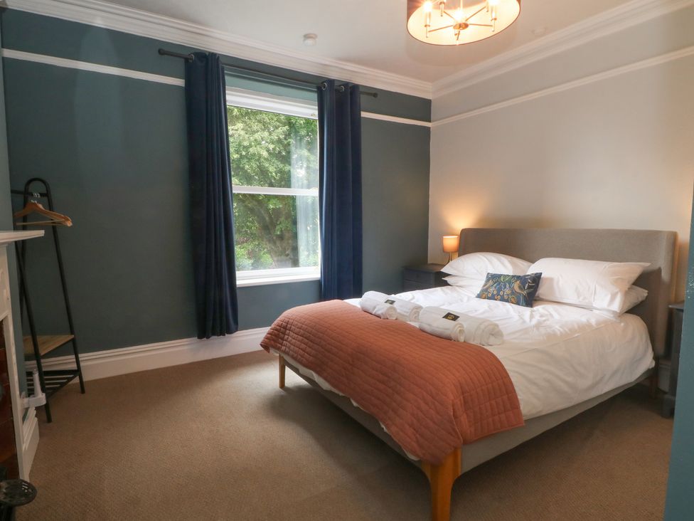 A bedroom with a bed and window at Montclair in Buxton