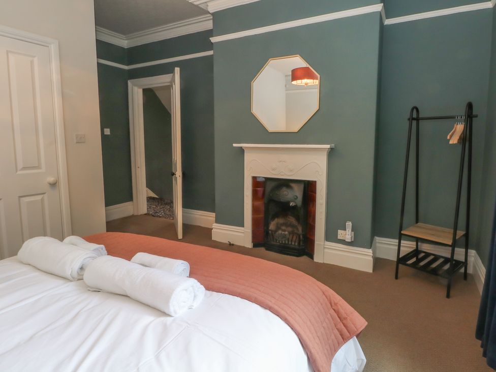 A bedroom with a bed and towels at Montclair in Buxton