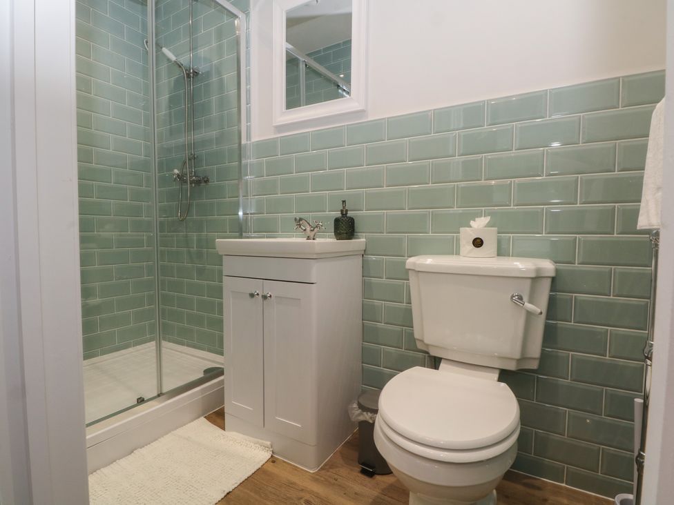 A bathroom with shower, toilet and vanity at Montclair in Buxton