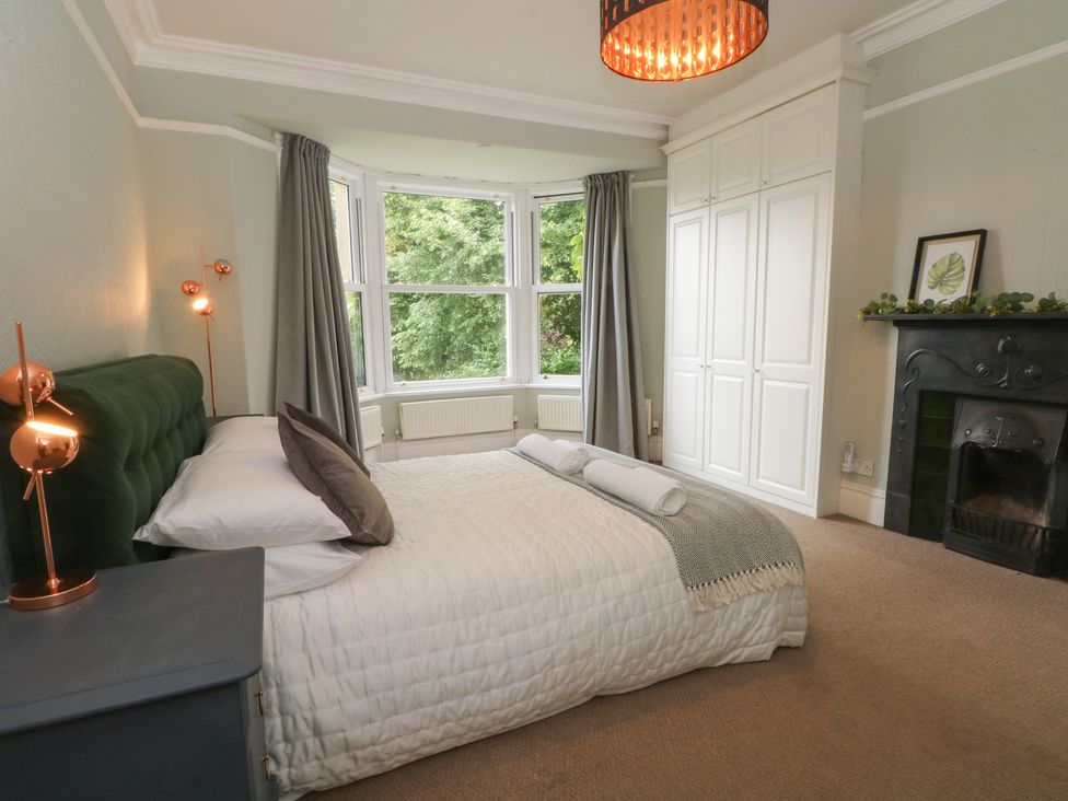 A bedroom with a bed and window at Montclair in Buxton