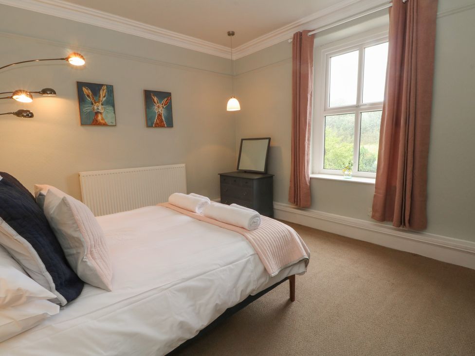 A bedroom with a bed and a window at Montclair in Buxton