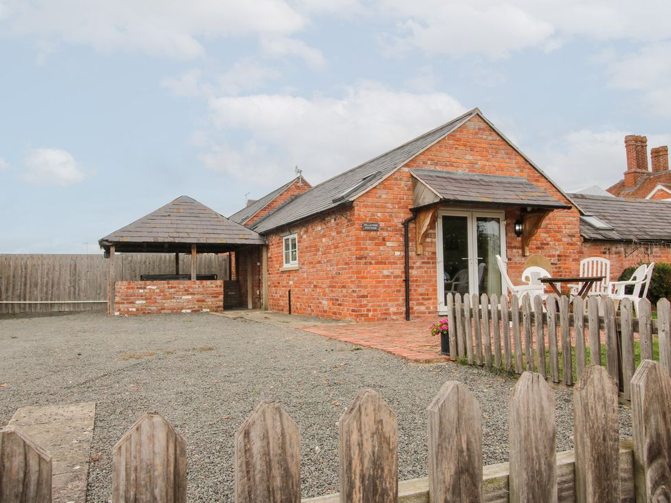 A cottage with garden furniture at Millstone Cottages - Millstone Cottage in Westbury