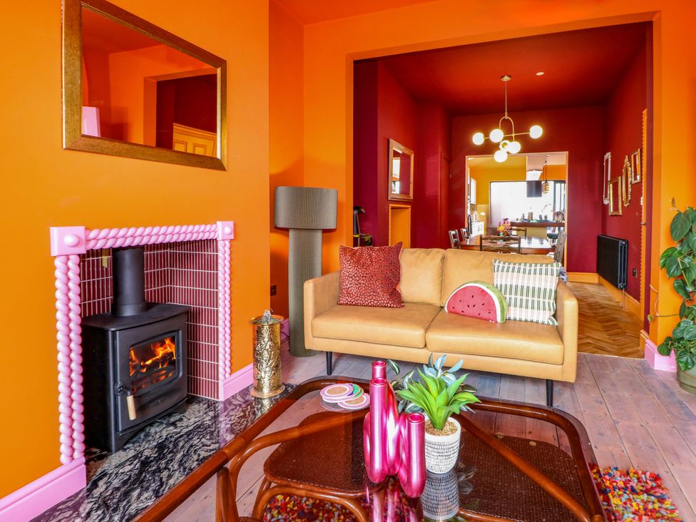 A living room with a sofa and fireplace at Hasting Heights in Hastings