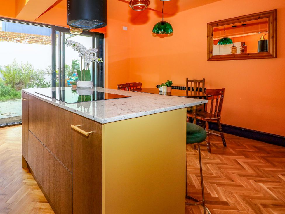 A kitchen with a large island and dining area at Hasting Heights in Hastings