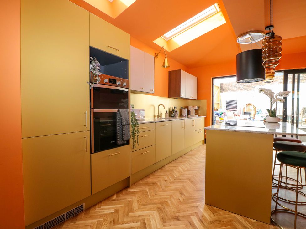 A kitchen with cabinets and a countertop at Hasting Heights in Hastings