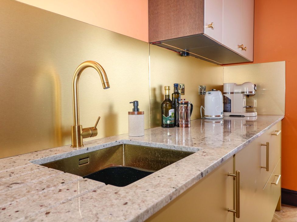 A kitchen with a sink and faucet at Hasting Heights in Hastings
