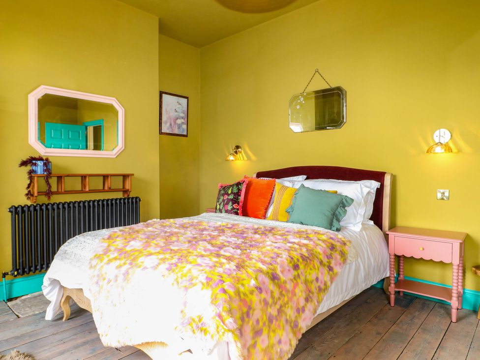 A bedroom with a bed and bedside table at Hasting Heights in Hastings