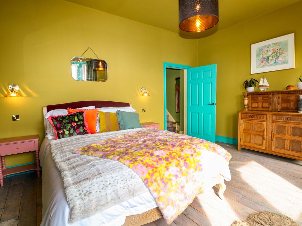 A bedroom with a bed and side table at Hasting Heights in Hastings