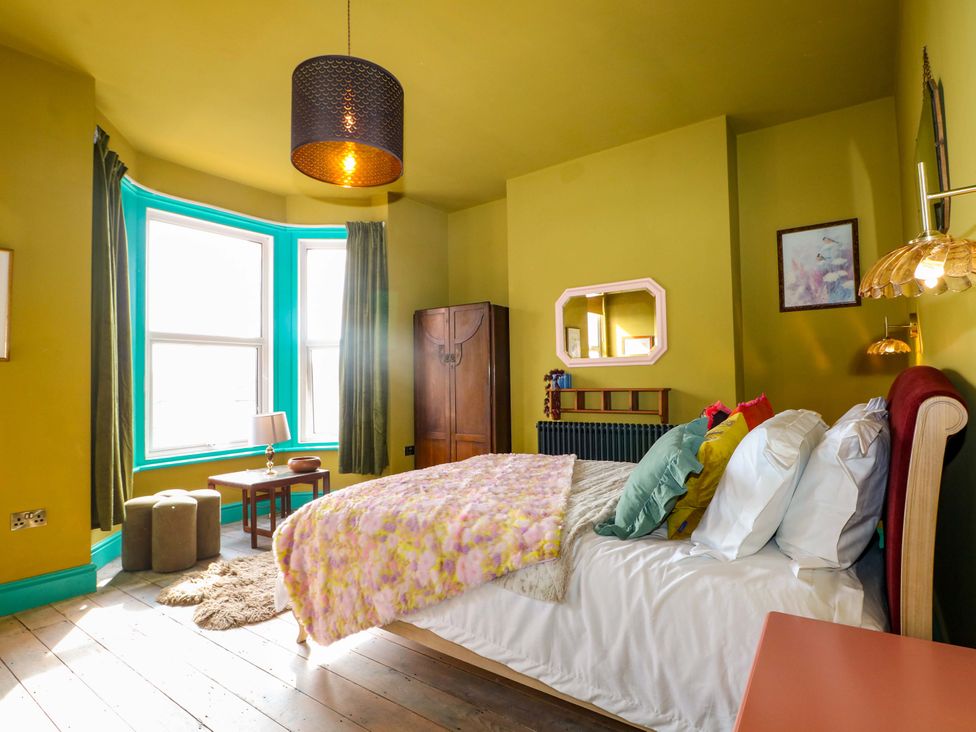 A bedroom with a bed and lamp at Hasting Heights in Hastings