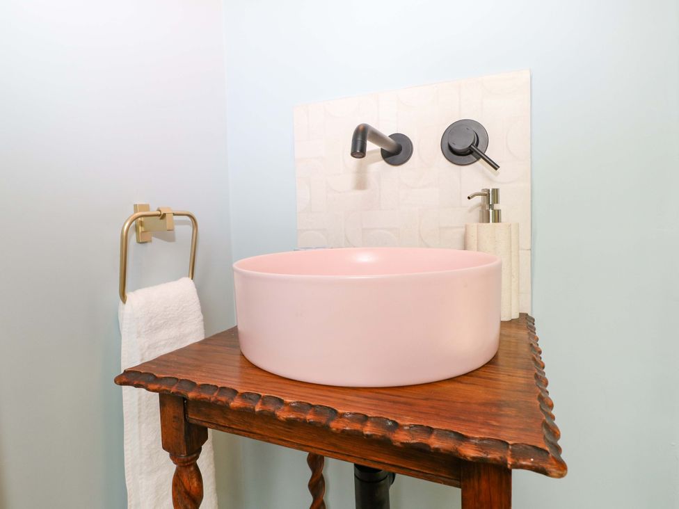 A sink and faucet on a table in a bathroom at Hasting Heights in Hastings