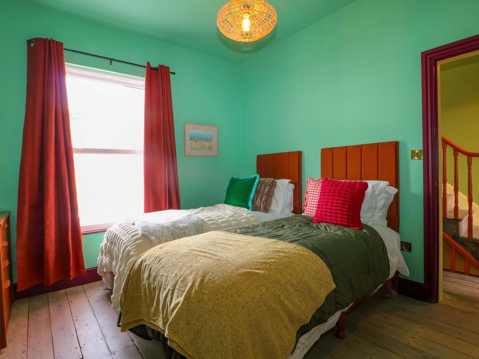 A bedroom with two beds and a window at Hasting Heights in Hastings