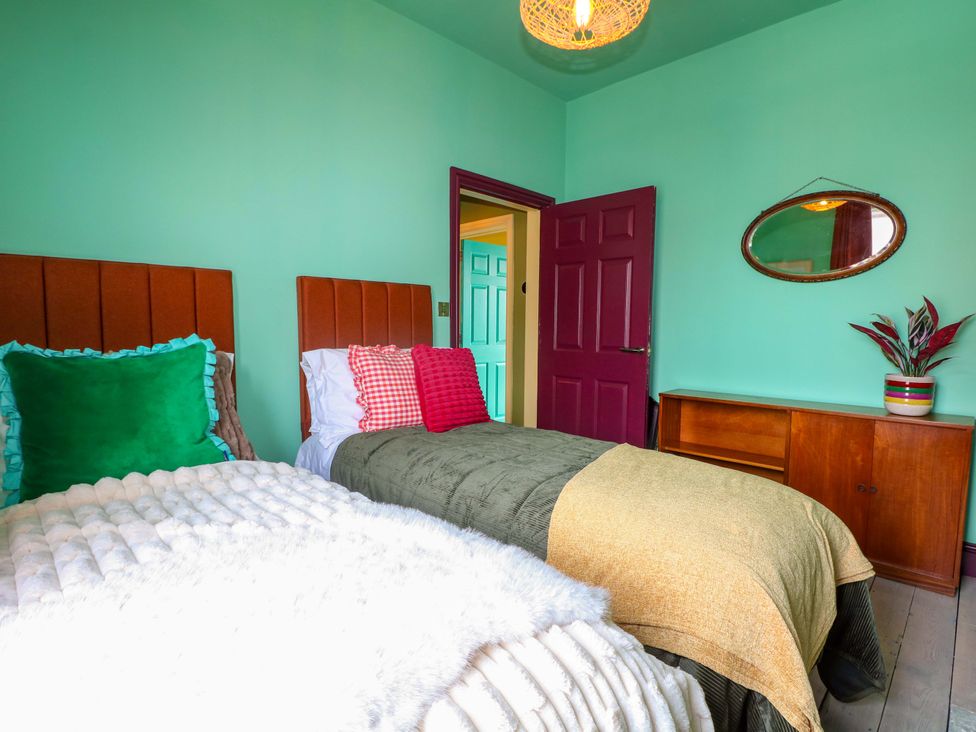 A bedroom with two beds and a cabinet at Hasting Heights in Hastings